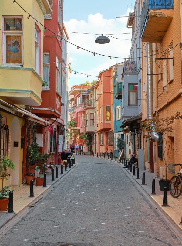Colorful narrow street in Balat, Istanbul, showcasing historic architecture and vibrant facades.