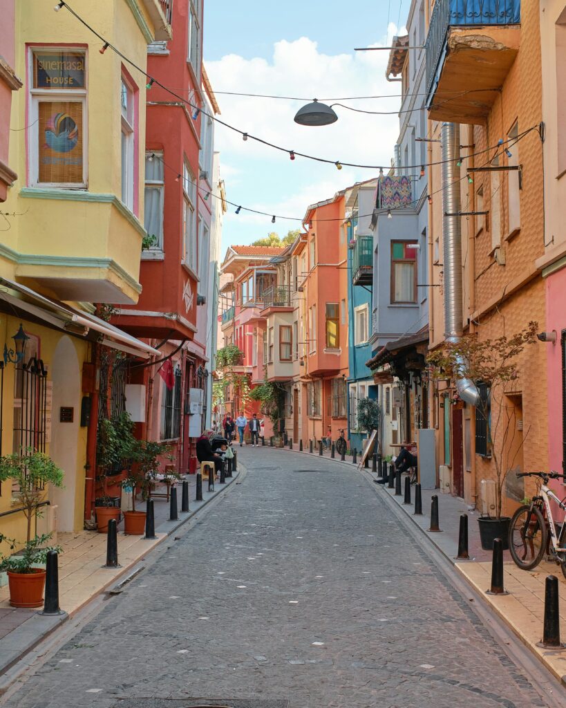 Colorful narrow street in Balat, Istanbul, showcasing historic architecture and vibrant facades.