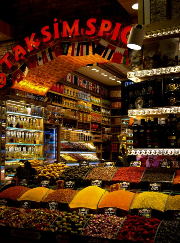 Vibrant display of spices and merchandise at Taksim Spice Market, Istanbul.
