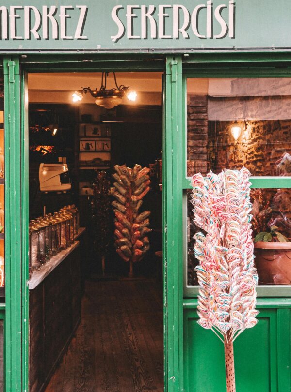 Explore this historic candy shop in Balat, Istanbul, showcasing delightful sweets in a vintage setting.